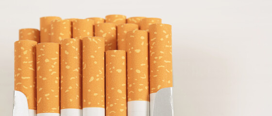 peel it off Cigarette pack prepare smoking on white wooden background. Packing line up.  photo filters Natural light.