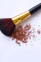 makeup brush and powder