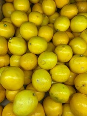 lots of ripe yellow lemons to eat as a background