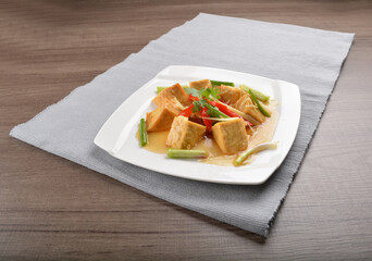 deep fried bean curd tofu with soy sauce on wood background asian halal vegan menu