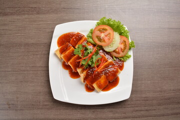 deep fried bean curd tofu with spicy sambal chilli sauce on wood background asian halal vegan menu