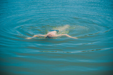 13 years Teenage boy swimming in lake, Children lifestyle. Enjoy the life