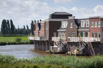 New built houses near water in a traditional architecture style in Gouda in the Netherlands