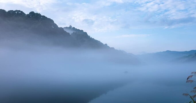 time lapse of the misty river landscape in early morning, fog over the little Dongjiang river, Zixing city, northeast of Chenzhou City, Hunan Province, China.
