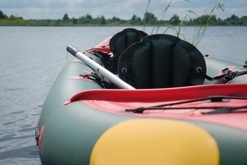 Kayaking on the Lake Concept Photo. Sport Kayak on the Rocky Lake Shore.fishing and hunting recreation