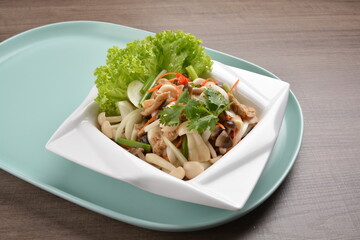 thai cold mushroom vegetable salad in spicy sour lime sauce on wood background asian halal vegan menu