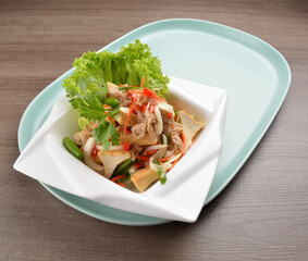 thai cold bean curd tofu vegetable salad in spicy sour lime sauce on wood background asian halal vegan menu