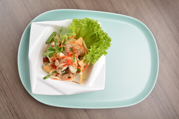 thai cold bean curd tofu vegetable salad in spicy sour lime sauce on wood background asian halal vegan menu