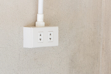 Electrical socket plug or Power Outlet On cement wall