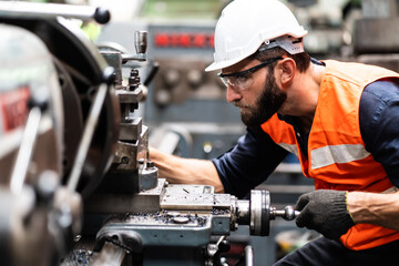 Man at work. Mechanical Engineer  man in Hard Hat Wearing Safety Jacket working in Heavy Industry...