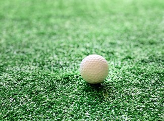 Golf balls on green grass of golf course background evening light shadow for banner copy space for text