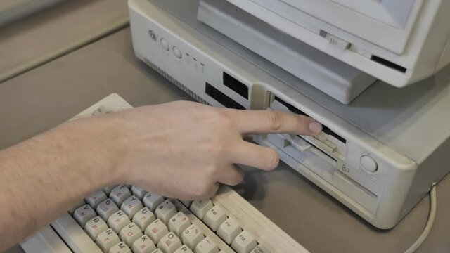 The Inserting 3.5 And 5.25 Inch Floppy Disks. Old-style Computer
