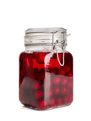Glass jar with sweet cherry wine on white background