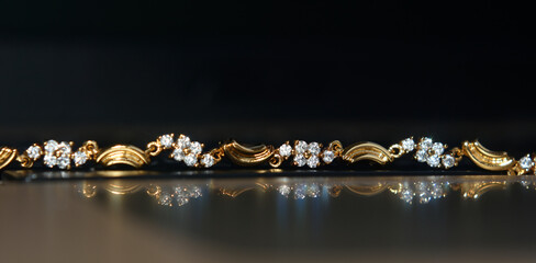 Gold is a real gold bracelet. set with diamonds a beautiful ornament