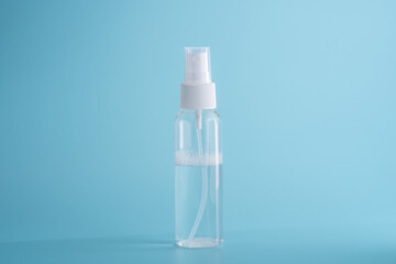 A transparent plastic bottle on a blue background