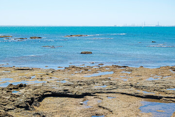 Large rocks on the beach of La Costilla Rota, Cadiz, Andalusia, Spain