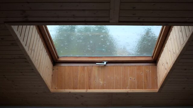 Strong rain seen by a skylight. High quality 4k footage