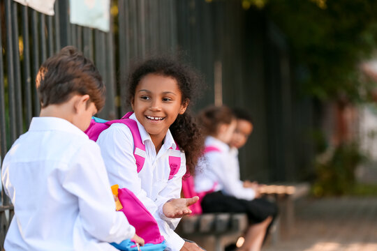 Cute Little Pupils Meeting After Summer Holidays. Back To School