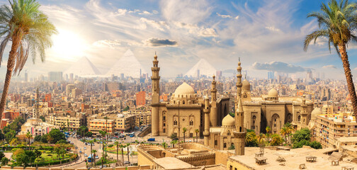 Mosque-Madrasa of Sultan Hassan behind the palm trees, Cairo, Egypt - obrazy, fototapety, plakaty