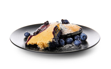 Plate with pieces of blueberry cobbler on white background