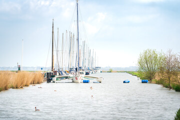 Harbour with moored sailboats at Schardam, North-Holland