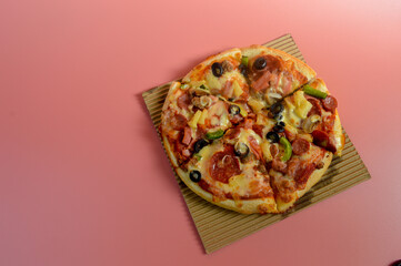 Supreme Mozzarella Cheese Pizza isolated on pink background