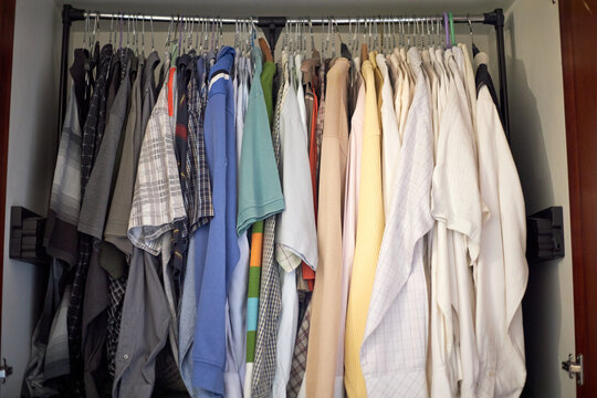 A Rack Of Second Hand Clothes In An Old Closet, Unused And Ready To Be Resold, Up For A Bargain