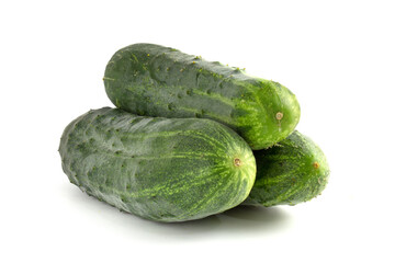 Three cucumbers close up isolated on white background.