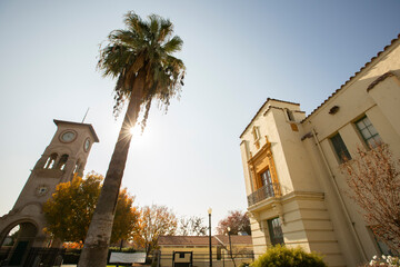 Fototapeta premium Daytime view of a historic public clock tower in downtown Bakersfield, California, USA.