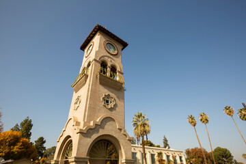 Daytime view of a historic public clock tower in downtown Bakersfield, California, USA.