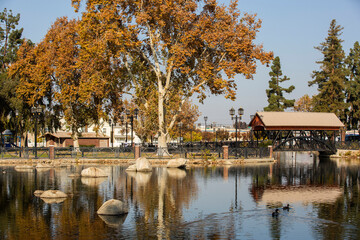 Afternoon autumn view of a public park in downtown Bakersfield, California, USA. - obrazy, fototapety, plakaty