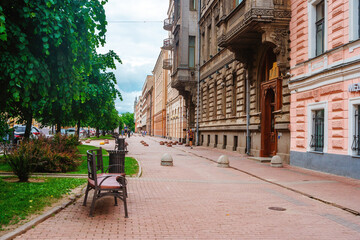 Fototapeta na wymiar View of the facades of historical buildings on the street in the city center in summer. Saint Petersburg, Russia - 13 June 2021