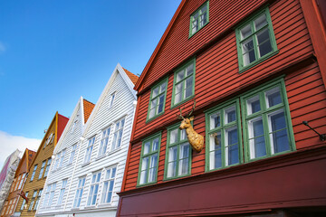Fototapeta na wymiar Colourful wooden houses of Bryggen the old wharf historic harbour district of Bergen, Norway. Its a Unesco World heritage listed and was rebuilt after being destroyed in a fire.