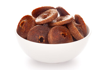 Close-up Organic dry fruit fig  (Ficus carica)  in white ceramic  bowl on white background