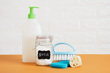 brush, glass soda can, plastic blank bottle with dispenser for soap or dishwashing detergent and silicone sponge