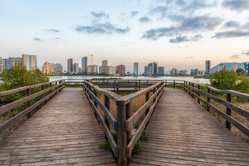 Fototapeta premium Wooden walkways near the salt flats of Calpe, in a beautiful sunset.