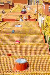 Unique skylight in tiled roofs typical for the city of Porto, North Portugal
