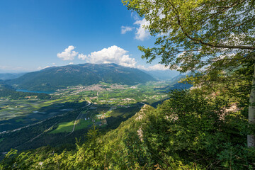 Aerial view of the small town of Levico Terme, tourist resort on the coast of Levico Lake, Valsugana (Sugana Valley), Trento province, Trentino Alto Adige, Italy, Europe.