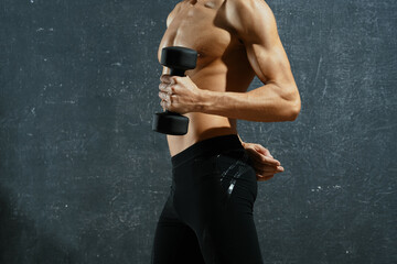 Fototapeta na wymiar athlete pumped up press workout motivation dark background