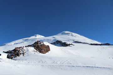 Fototapeta na wymiar The double-headed peak of the highest mountain in Europe Elbrus