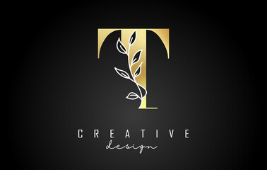 Golden T letter logo design with white leaves branch vector illustration.