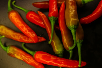 red hot chilli peppers on black background