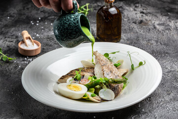 Fried fish with stewed greens. Zander Fillet, pike perch fish fillet. Restaurant menu, dieting,...