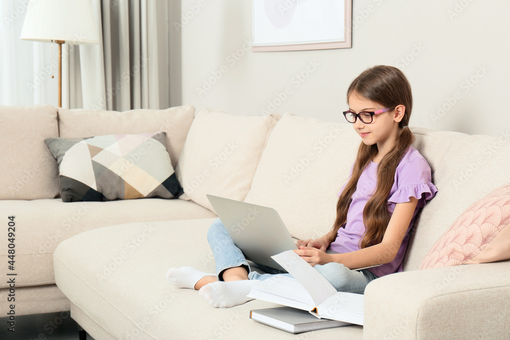 Sticker Girl with laptop and books on sofa at home