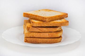 Several crispy toasted toasters are spread across a white backdrop. Isolated