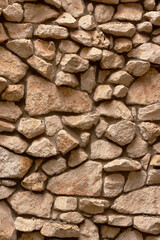A wall of large brown cobblestone.