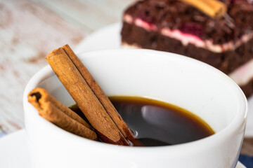 Close-up of cinnamon stick in a cup of coffee