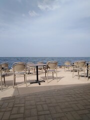 table and chairs on the beach