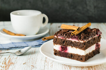 Cake with cherry cinnamon and chocolate chips in a close-up, early morning