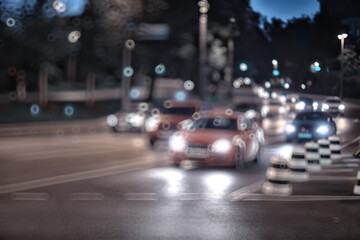 abstract blurred view of the night city from a car window, traffic in the city